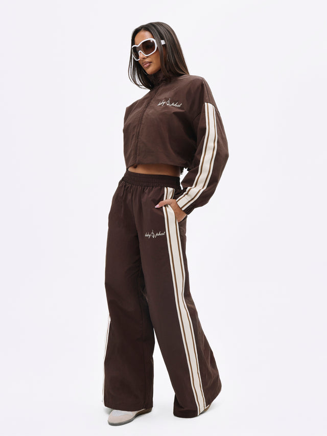 Nylon Track Pant With Side Stripe, brown with cream stripe panels, on-model styling view