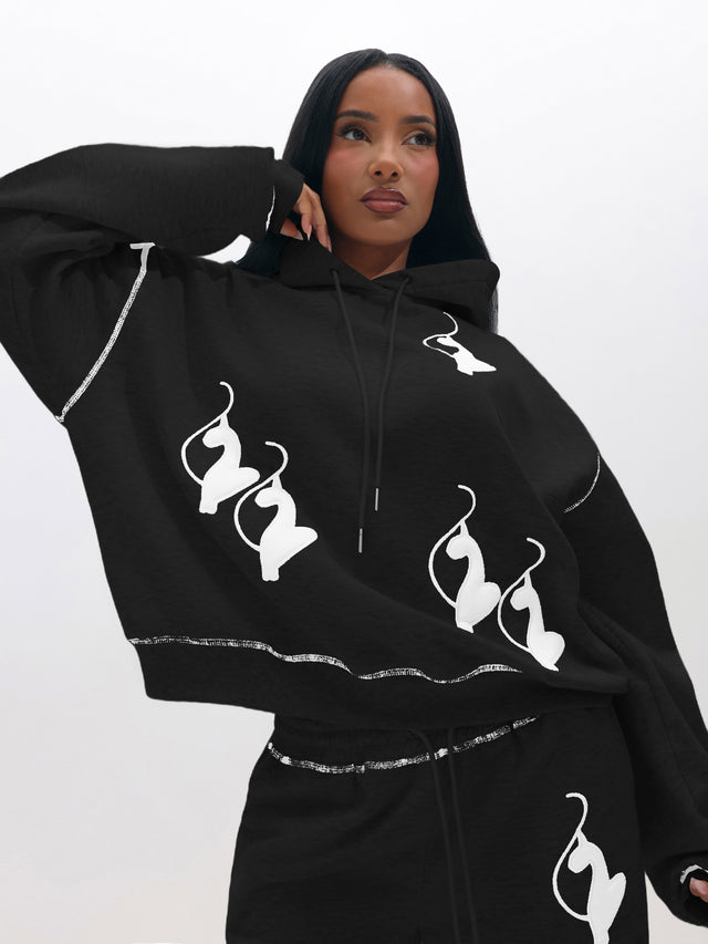 Logo Marled Hoodie, black hoodie with white allover logo graphic, on-model styling view