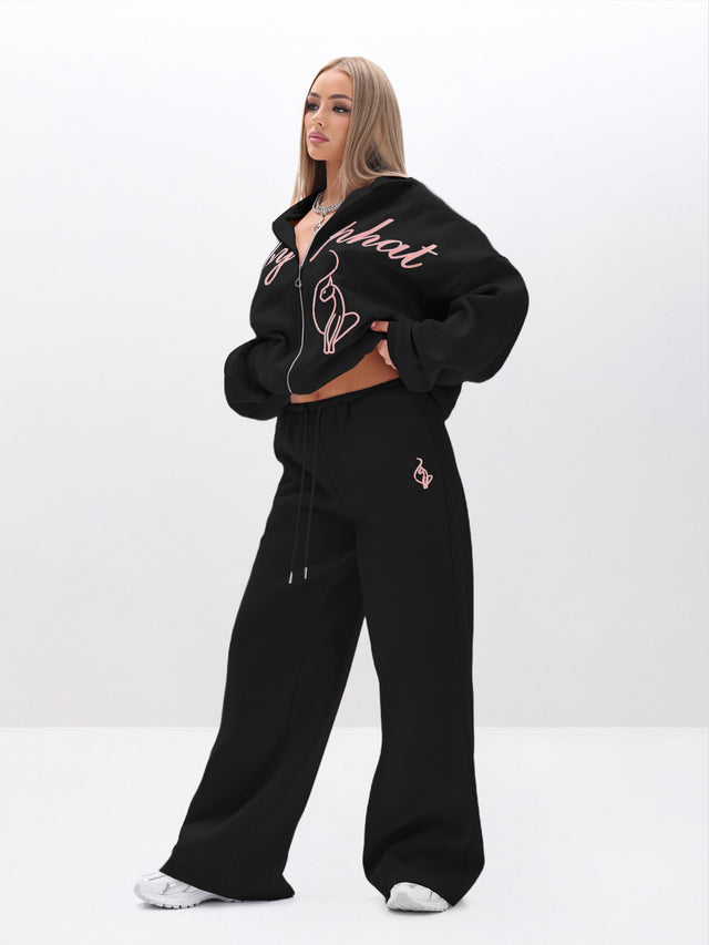 Baggy Sweatpants With Applique, black fleece with pink logo detail, on-model styling view