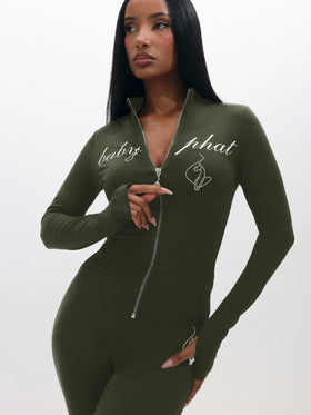 Long Sleeve High Neck Zip Up Top, olive green fitted zip-front from angled pose, on-model styling view