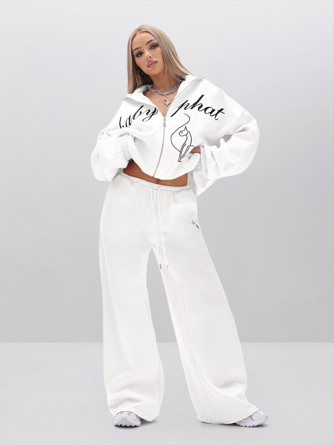 Baggy Sweatpants With Applique, white fleece with logo detail, on-model styling view