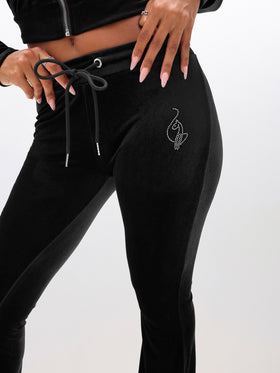 Low Rise Velour Sweatpants With Rhinestones, rhinestone cat logo near hip on black velour, logo detail