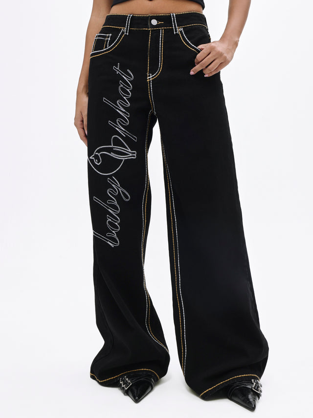 Contrast Logo Baggy Jean, large script logo on leg, close-up detail
