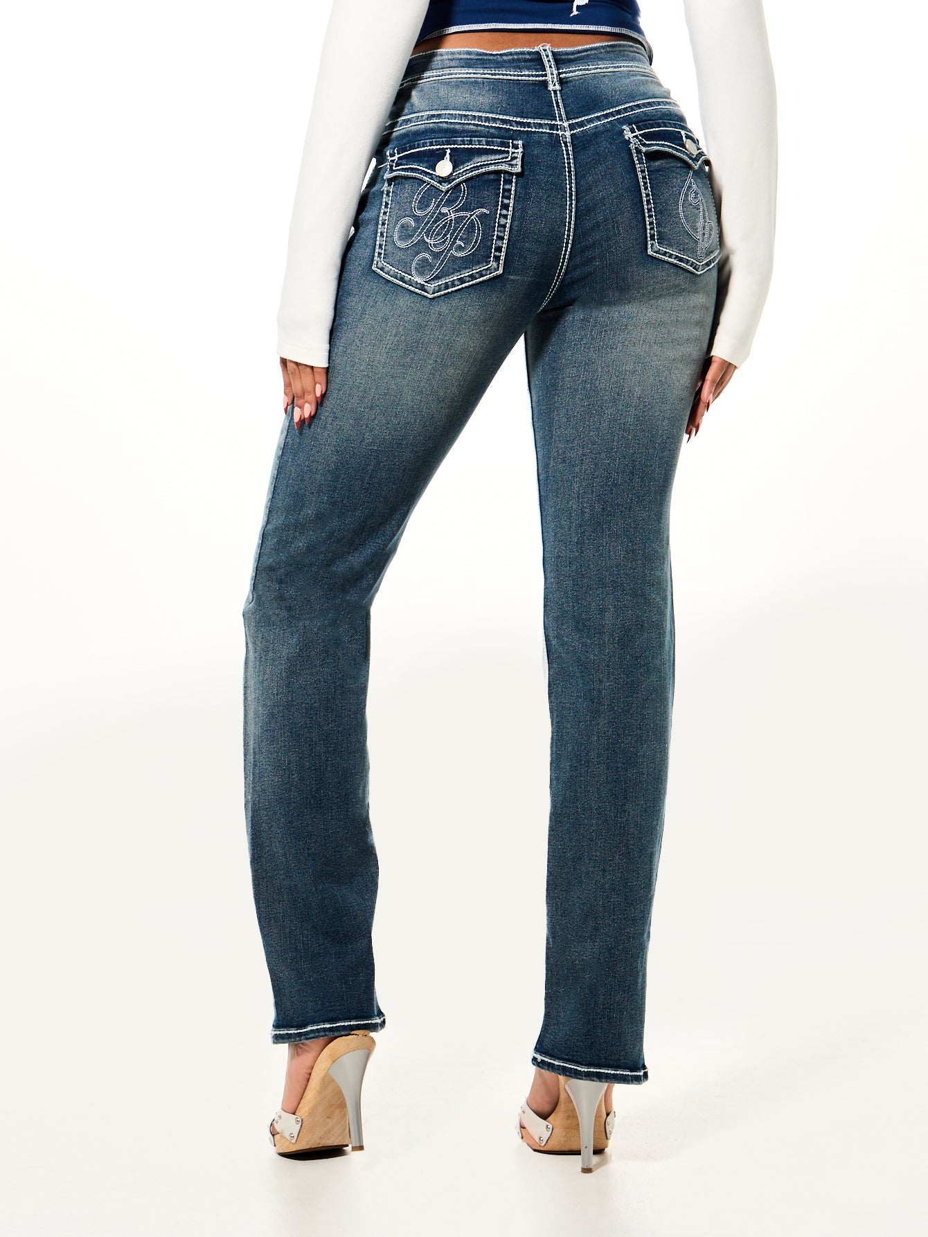 Straight Leg Jean, embroidered flap pockets and faded wash, back view