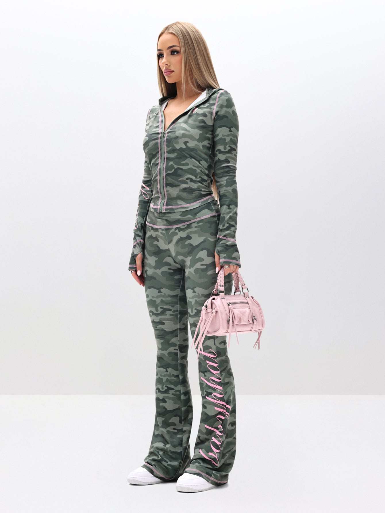 Fold Over Flare Leggings in Camo, green camo flare leg with pink logo detail, side view