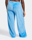 Back view image of plus sized model shown wearing blue velour sweatpants. Pants feature a wide leg, open bottom fit with a rhinestone Baby Phat cat logo on the wearer's left upper thigh. Pants feature pockets and an elastic waistband with a drawstring tie.