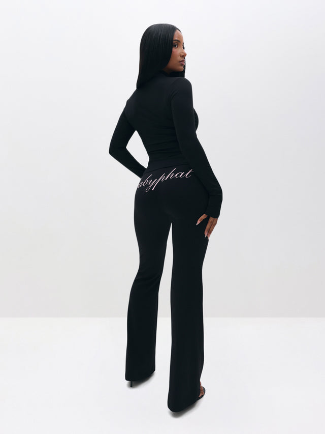 Pull On Flare Leggings, black flared silhouette with script logo at back, back view