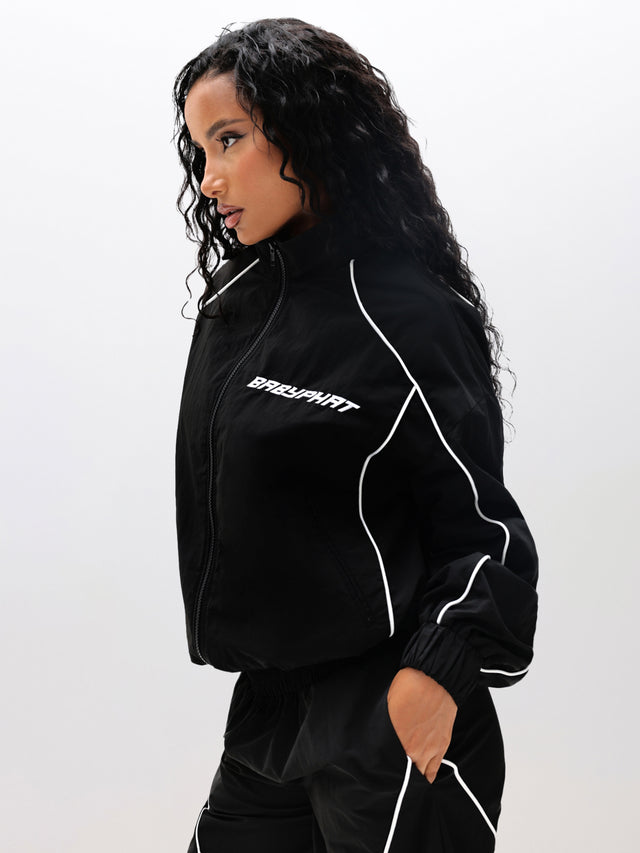Nylon Track Jacket, black with chest logo and piping, side view