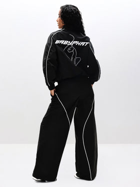 Nylon Track Jacket, back logo with angled pose, on-model styling view