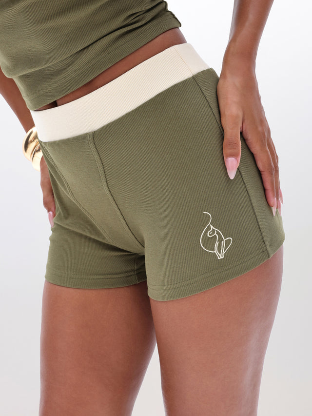 Ribbed Boxer Style Short, olive rib texture with contrast waistband, close-up detail
