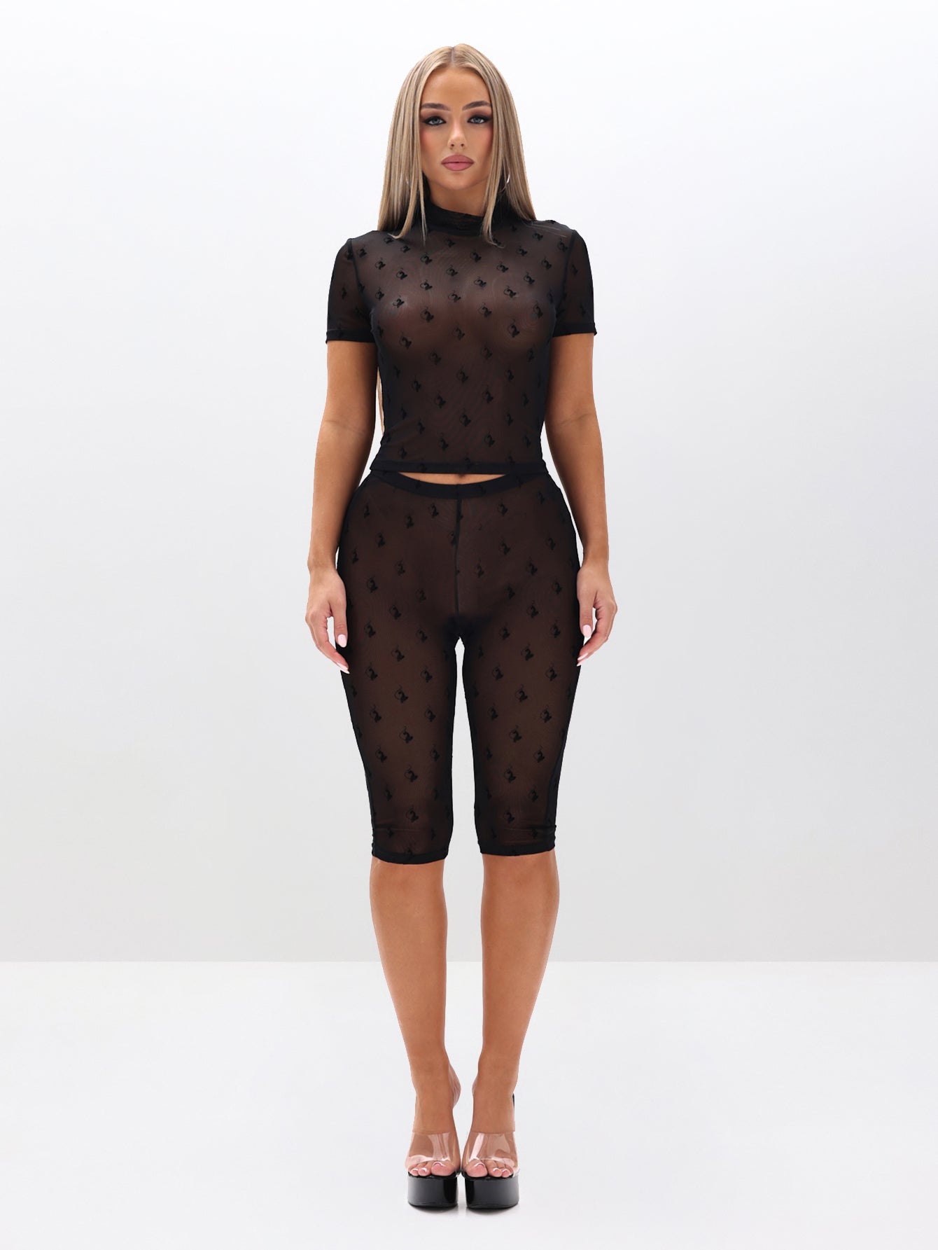 Mesh Sheer Capri Leggings, black sheer mesh with logo motif, front full-body view