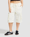 Front view image of standard sized model’s legs wearing off white cargo short with visible belt loops and tied waist. Shorts feature exaggerated pocket detailing down both legs.