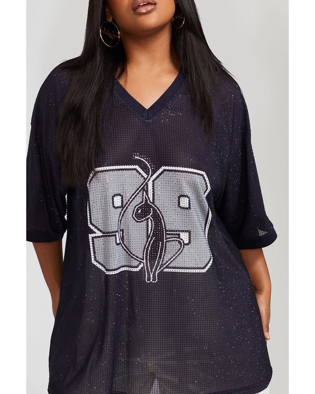 Detail view image shows model wearing black oversized jersey with black rhinestones all over. Jersey features grey 99 logo large at center back with grey rhinestones. 