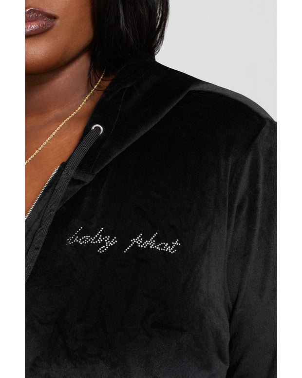 Detail shot of rhinestone script Baby Phat logo on left chest of sweatshirt.