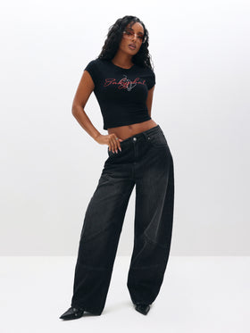 Raglan Graphic Baby Tee, black logo crop with relaxed stance, on-model styling view