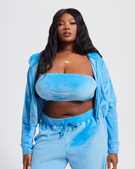 Essential Logo Bandeau, layered under zip hoodie in blue velour, on-model styling view