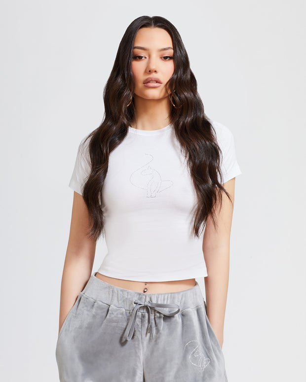 Standard sized model shown wearing white baby tee t-shirt with rhinestone Baby Phat cat logo on center front. 
