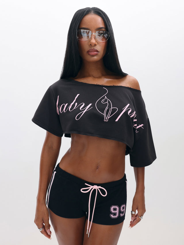 One Shoulder Cropped Sweat Top, black one-shoulder neckline with pink script logo, front view