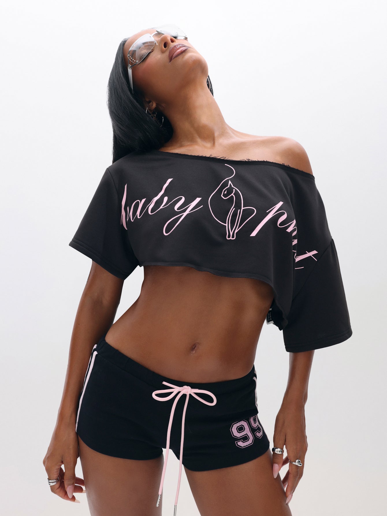 One Shoulder Cropped Sweat Top, black with pink script logo, on-model styling view
