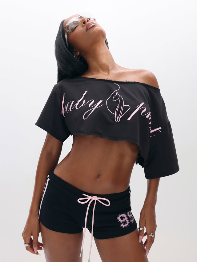 One Shoulder Cropped Sweat Top, black with pink script logo, on-model styling view