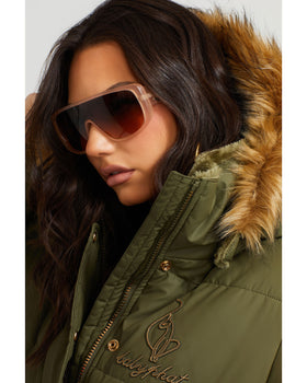 OLIVE PUFFER, olive jacket with chest embroidery and fur hood, close-up detail