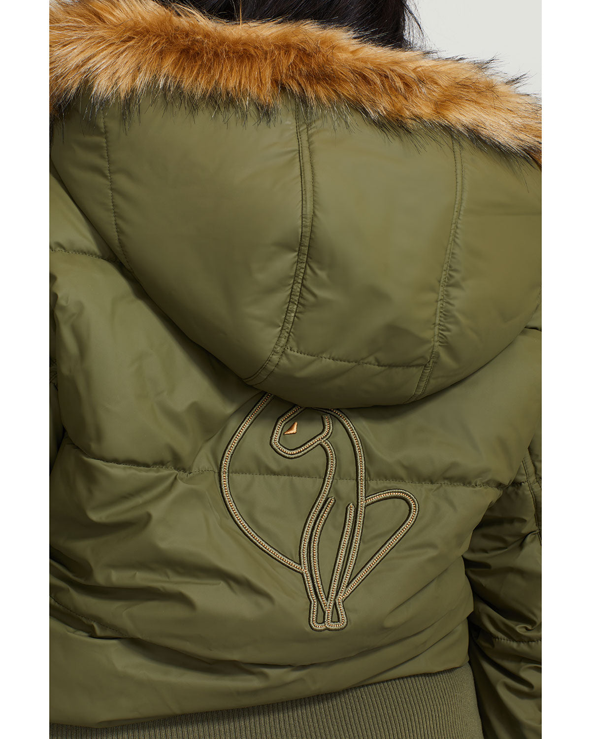 Plus sized model shown wearing olive green puffer jacket. Coat features faux fur detachable hood and Baby Phat script logo on front chest and oversized cat logo on the back. Jacket also features gold cat logo zipper pulls on the front pockets and center front.