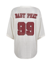 Baby Phat oversized rhinestone jersey in cream features rhinestones all over and a large 99 logo in burgundy on center back. Baby Phat logo in block letters featured on the top of back.