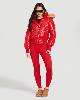 Chili Puffer, glossy red jacket styled with leggings, front full-body view