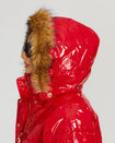 Model shown wearing glossy red puffer jacket. Coat features natural faux fur trimmed detachable hood and Baby Phat script logo on front chest and oversized cat logo on the back. Jacket also features gold cat logo zipper pulls on the front pockets and center front.