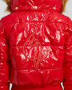 Model shown wearing glossy red puffer jacket. Coat features natural faux fur trimmed detachable hood and Baby Phat script logo on front chest and oversized cat logo on the back. Jacket also features gold cat logo zipper pulls on the front pockets and center front.