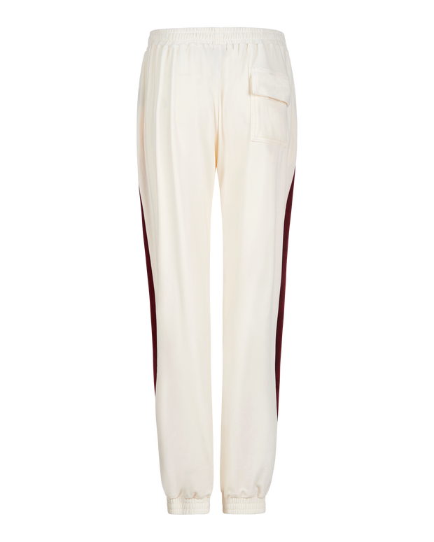 Baby Phat heritage sweatpant in cream features burgundy side stripe down the leg and large flap pocket on the butt. Pants feature elastic waistband and elastic hem.