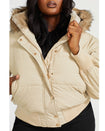 Plus sized model shown wearing light tan puffer jacket. Coat features natural faux fur trimmed detachable hood and Baby Phat script logo on front chest and oversized cat logo on the back. Jacket also features gold cat logo zipper pulls on the front pockets and center front.