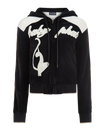 Velour zip up sweatshirt in black features cream color blocking. Baby Phat script logo across the chest. Oversized cat logo on the front of jacket. Back of jacket features additional cat logo.