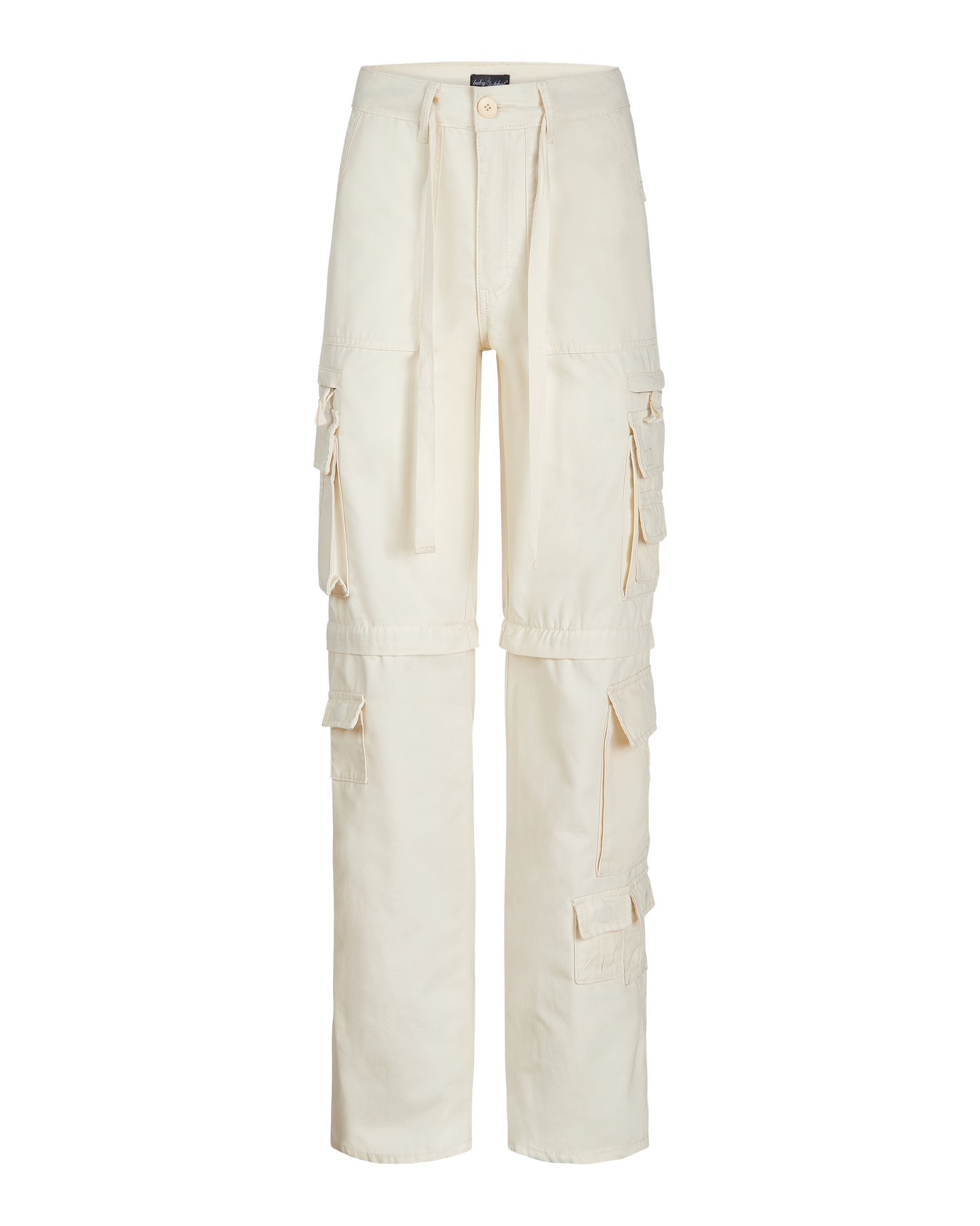 Transformer boyfriend pant in cream features cargo pockets throughout. Pants feature zipper to transform pants into shorts. 