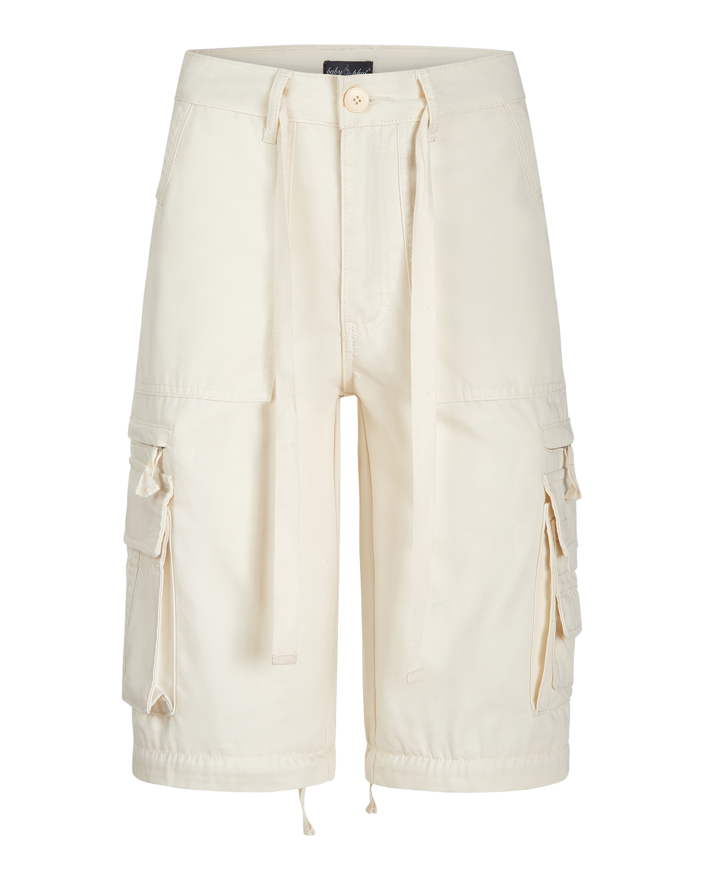 Transformer boyfriend pant in cream features cargo pockets throughout. Pants feature zipper to transform pants into shorts. 