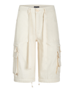 Transformer boyfriend pant in cream features cargo pockets throughout. Pants feature zipper to transform pants into shorts. 