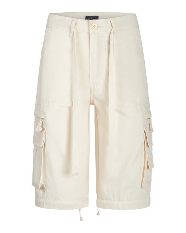 Transformer boyfriend pant in cream features cargo pockets throughout. Pants feature zipper to transform pants into shorts. 