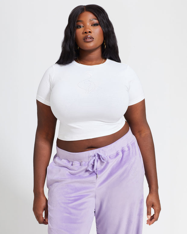 Plus sized model shown wearing white baby tee t-shirt with rhinestone Baby Phat cat logo on center front. 
